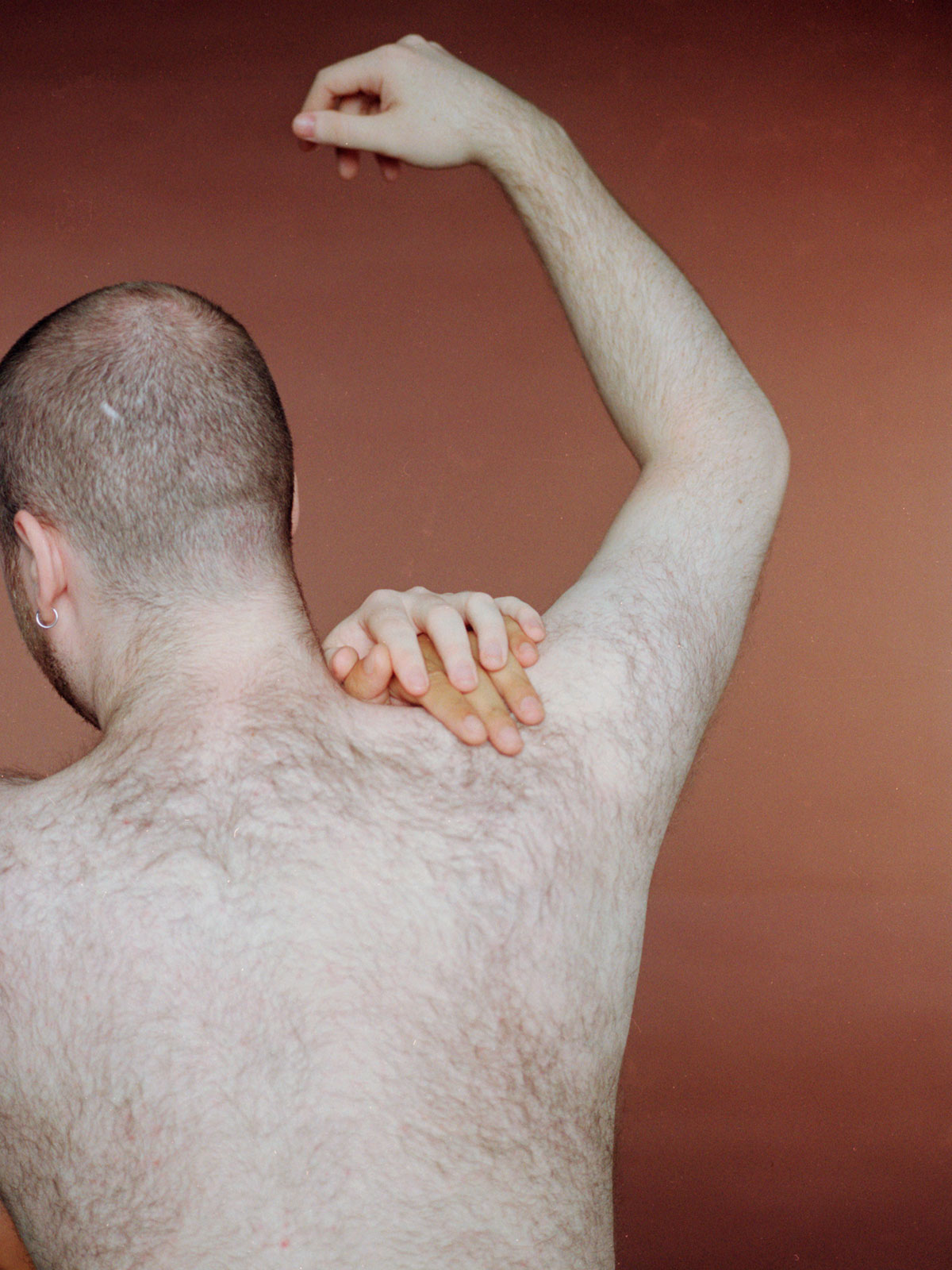 <p>Patrick Togher, a BA Hons Photography graduate, created ‘Under the Touch of Giants’. It consists of darkroom prints and photobook that are part of a wider academic and personal investigation into queer-male attraction and desire.</p>
